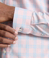 Model is wearing UNTUCKit Clark shirt in light pink check. 