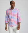 Model is wearing UNTUCKit Clarkson cotton linen shirt in red. 