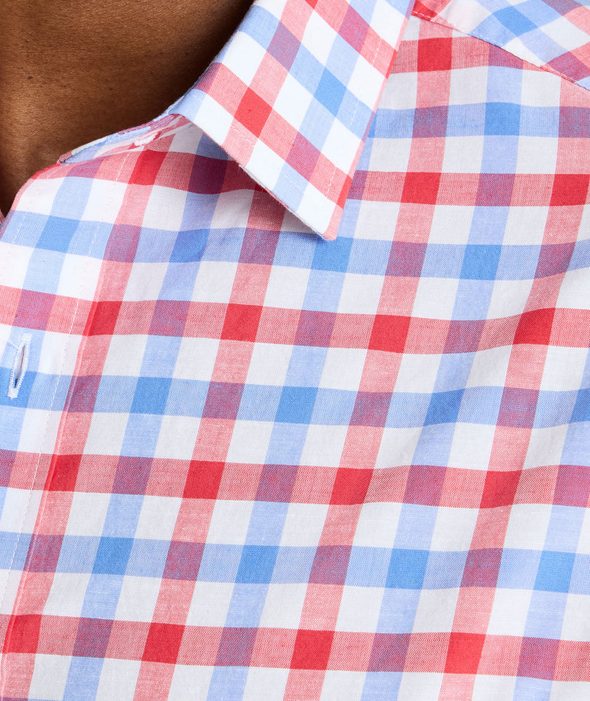 Model is wearing UNTUCKit Clarkson cotton linen shirt in red. 