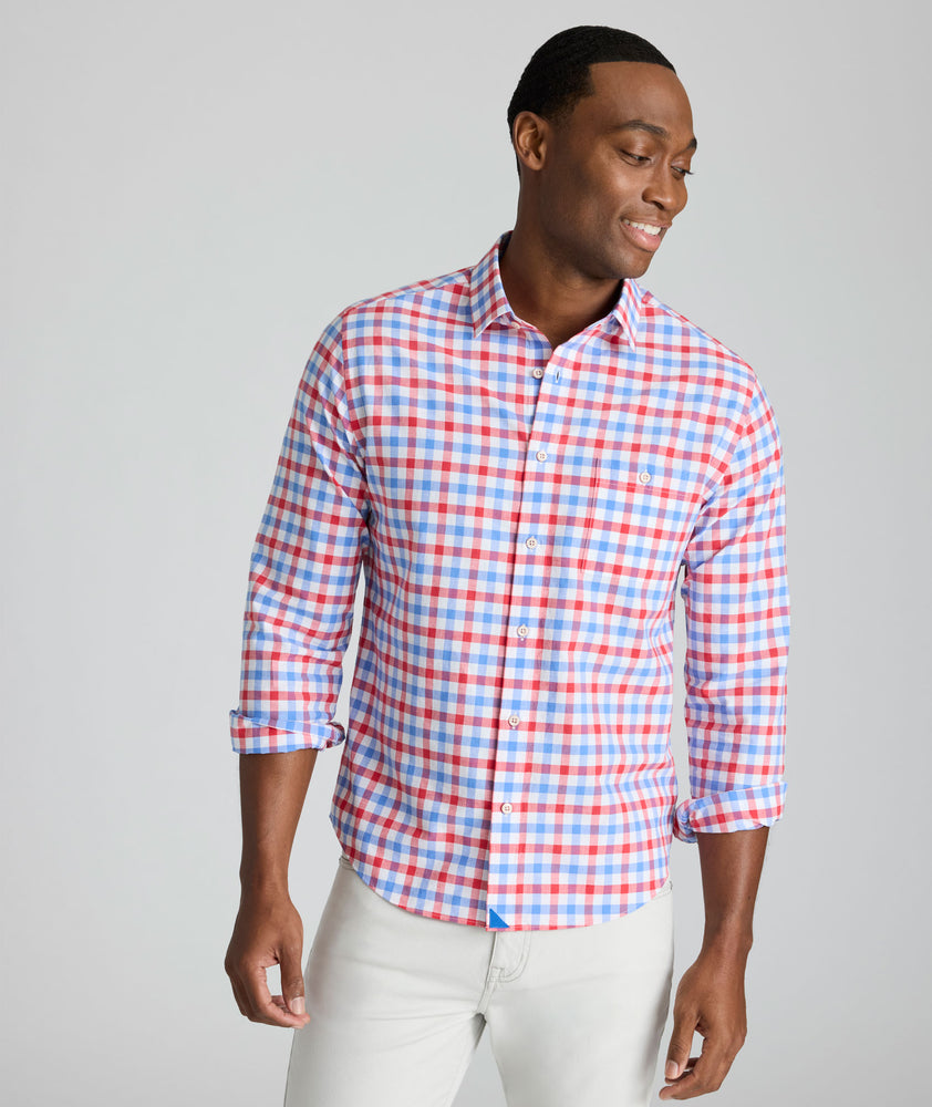 Model is wearing UNTUCKit Clarkson cotton linen shirt in red. 