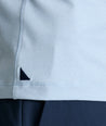 Model is wearing UNTUCKit Clavier performance polo.