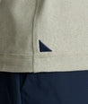 Model is wearing UNTUCKit Clavidor performance polo in shadow.  
