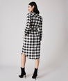 Model is wearing UNTUCKit Colby dress in black plaid.