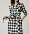 Model is wearing UNTUCKit Colby dress in black plaid.