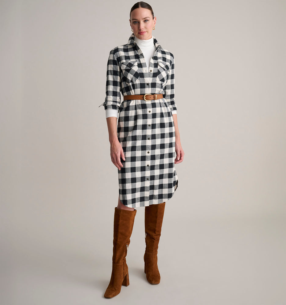 Model is wearing UNTUCKit Colby dress in buffalo check. 