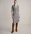 Model is wearing UNTUCKit Colby dress in buffalo check. 