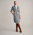 Model is wearing UNTUCKit Colby dress in buffalo check. 