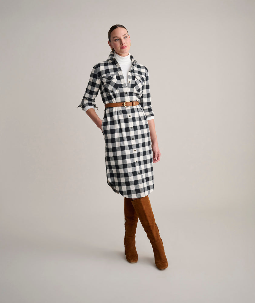Model is wearing UNTUCKit Colby dress in buffalo check. 