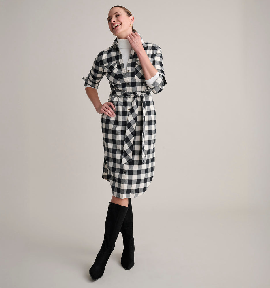 Model is wearing UNTUCKit Colby dress in buffalo check. 