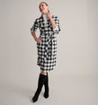 Model is wearing UNTUCKit Colby dress in buffalo check. 