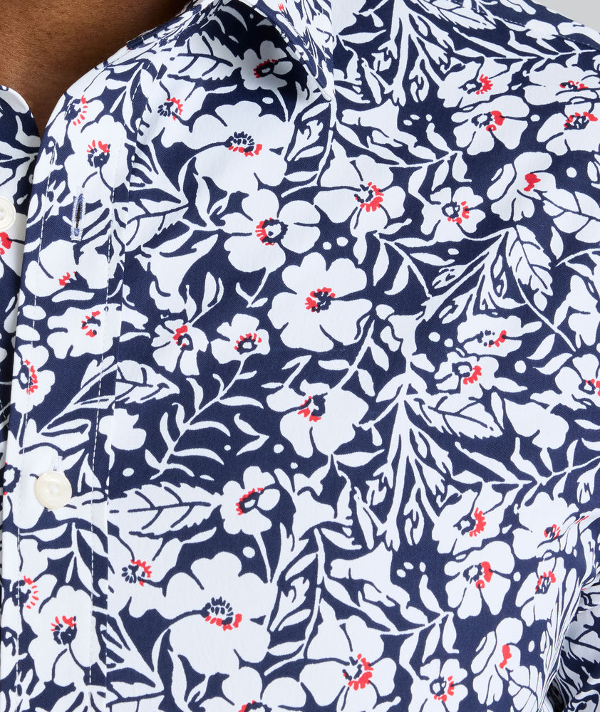 Model is wearing UNTUCKit Conner performance shirt in navy print. 