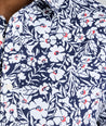 Model is wearing UNTUCKit Conner performance shirt in navy print. 