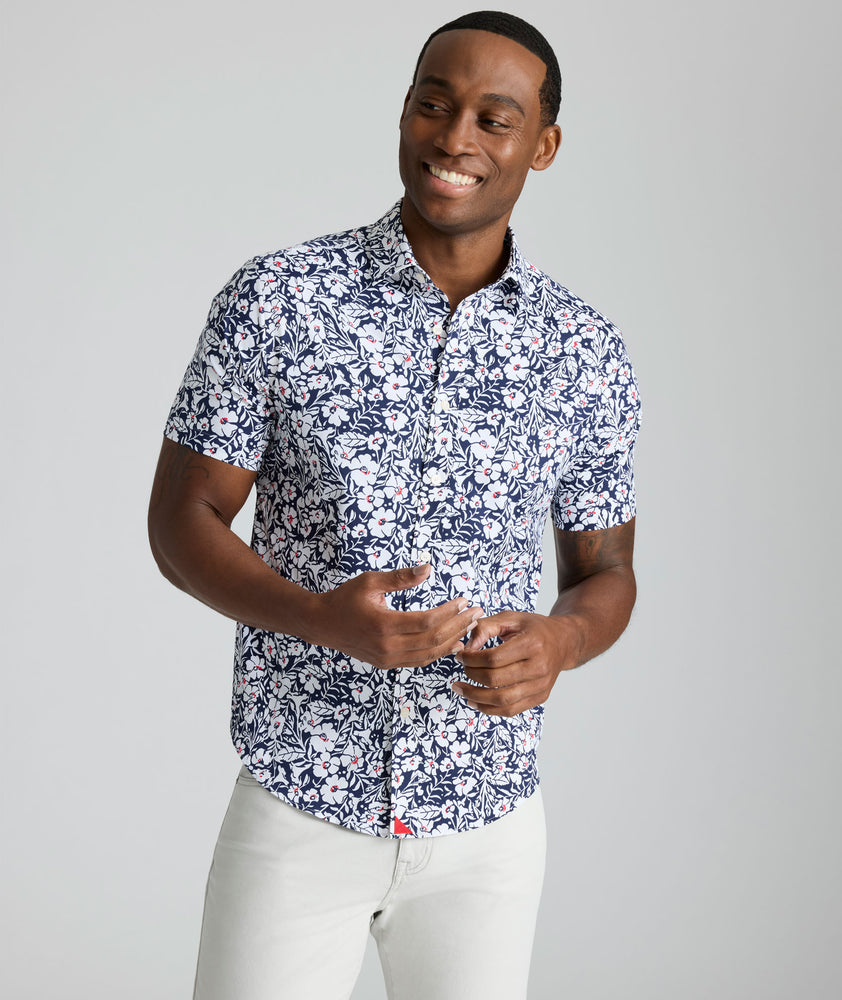 Model is wearing UNTUCKit Conner performance shirt in navy print. 