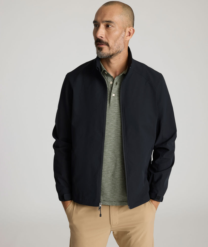 Model is wearing UNTUKit Connolly jacket in black beauty. 