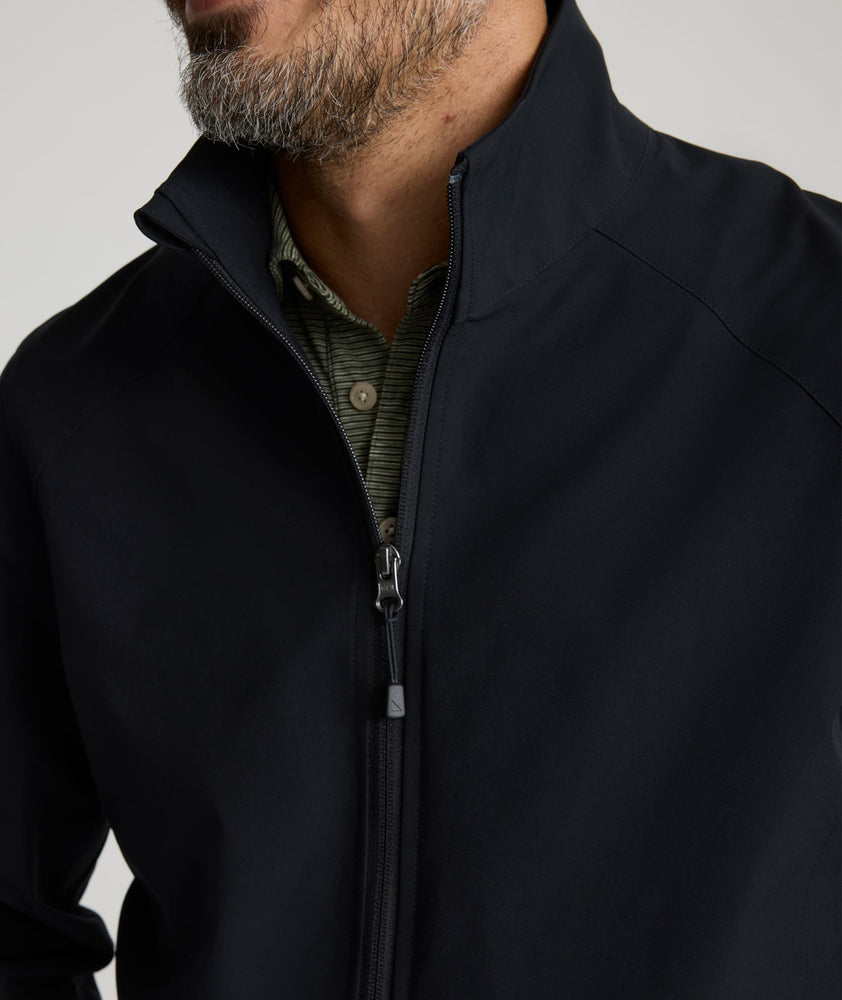 Model is wearing UNTUKit Connolly jacket in black beauty. 