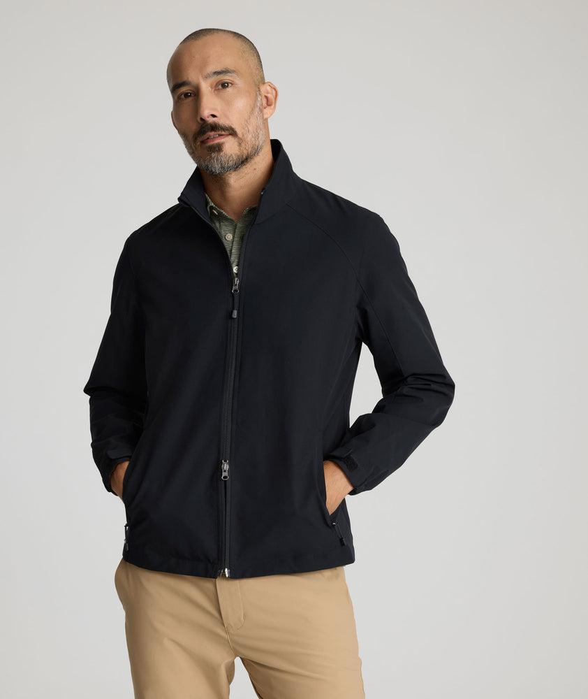 Model is wearing UNTUKit Connolly jacket in black beauty. 