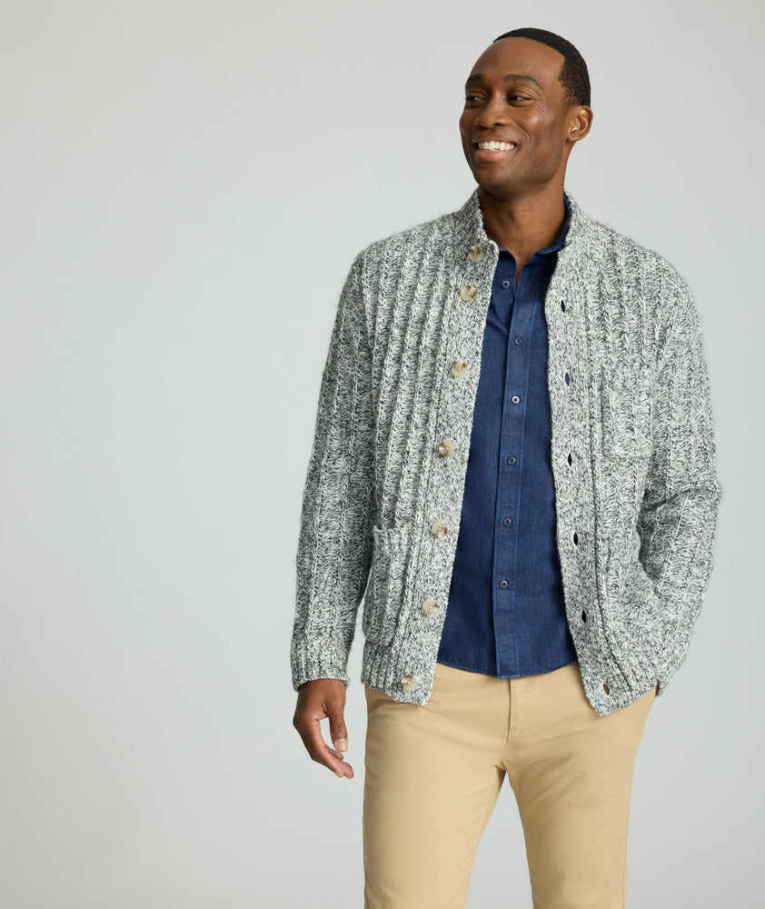 Model is wearing UNTUCKit Chunky Knit Cardigan in gray. 