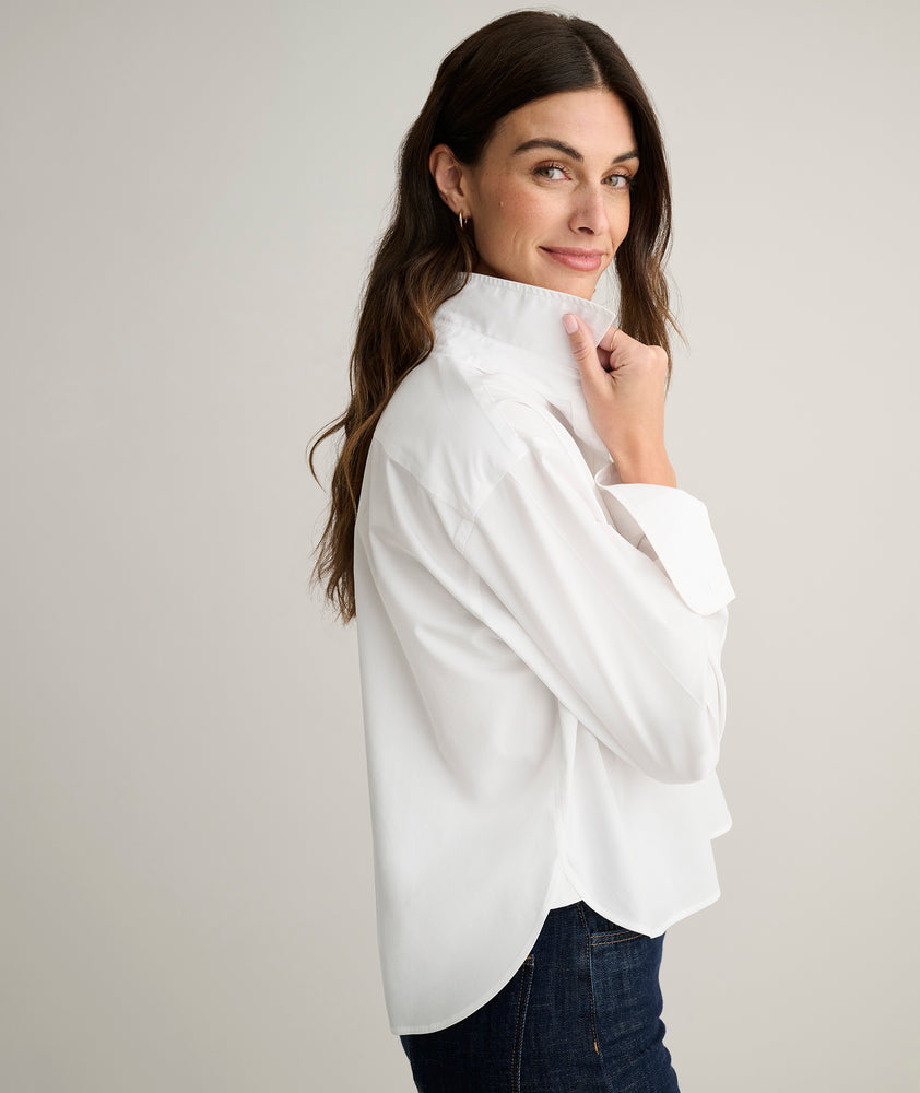 Model is wearing UNTUCKit Crosby dress in white. 