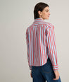 Model is wearing UNTUCKit Crosby shier in red and blue stripes. 