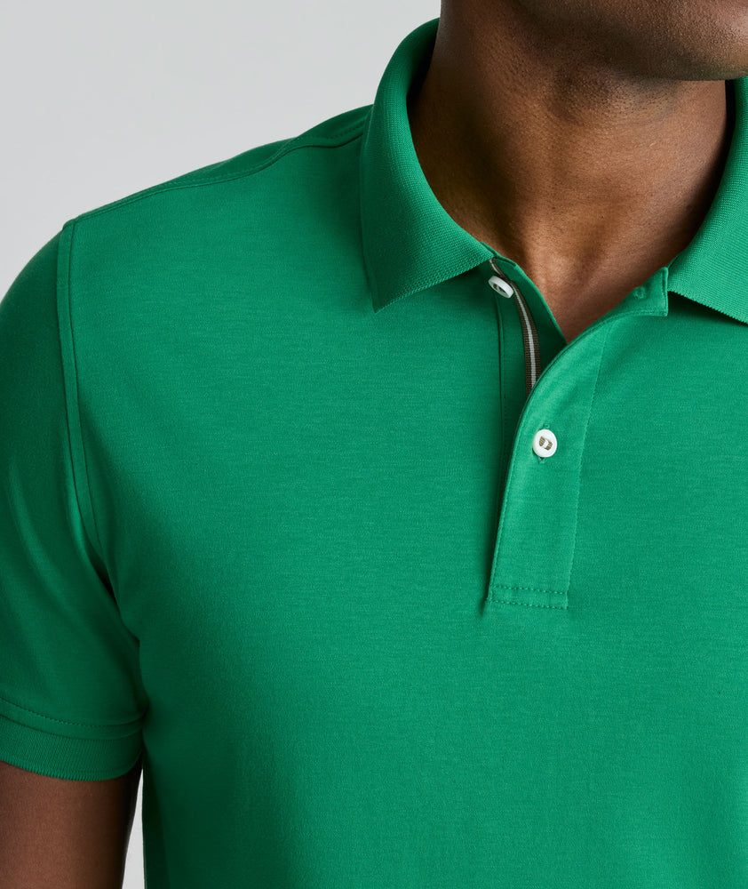 Model is wearing UNTUCKit Wrinkle-Free Damaschino Polo in bright green. 