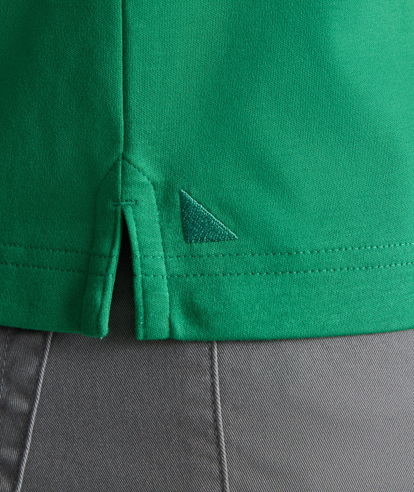Model is wearing UNTUCKit Wrinkle-Free Damaschino Polo in bright green. 