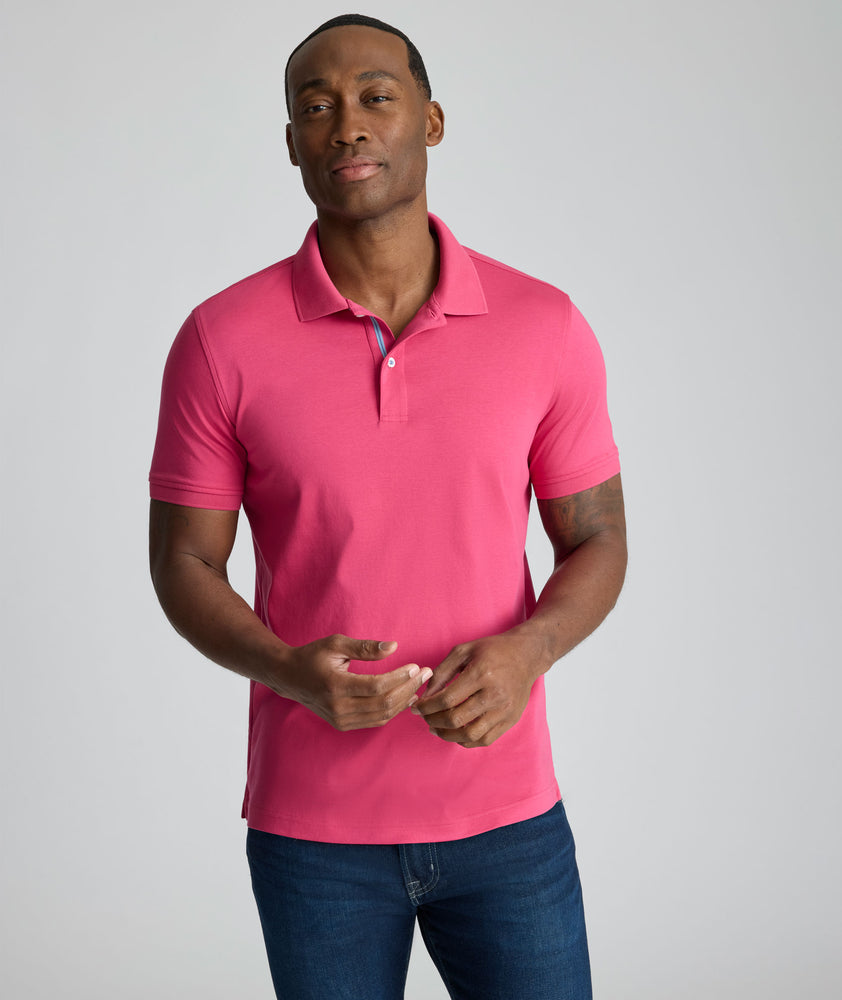 Model is wearing UNTUCKit Wrinkle-Free Damaschino Polo in Magenta.
