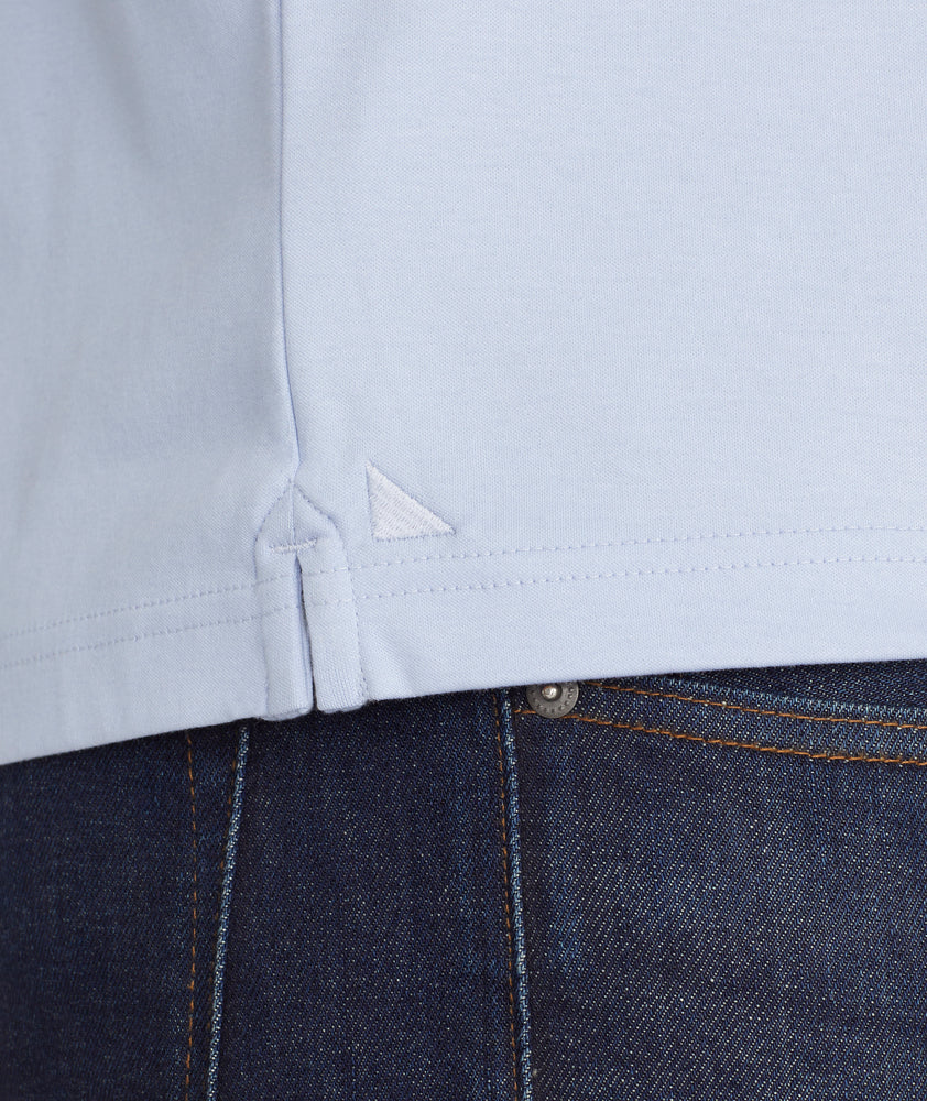 Model is wearing Wrinkle-Free Damaschino Polo in Flower Blue.