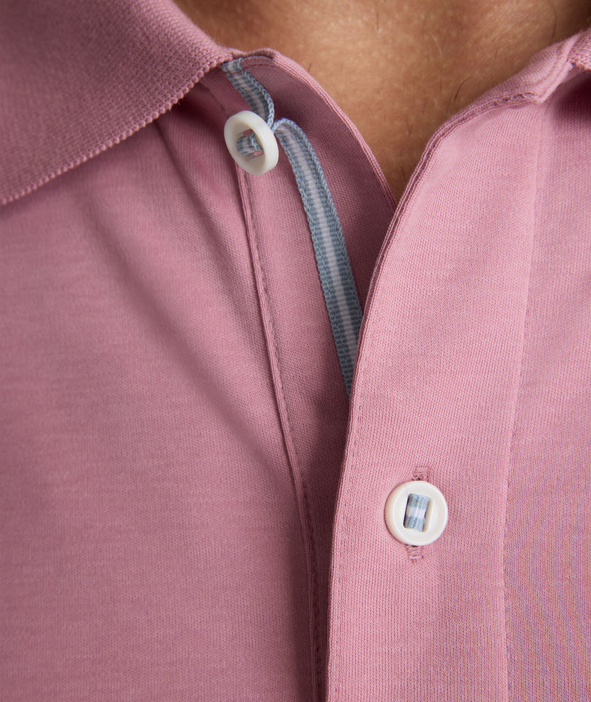 Model is wearing UNTUCKit Wrinkle-Free Damaschino Polo in dark pink. 
