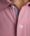 Model is wearing UNTUCKit Wrinkle-Free Damaschino Polo in dark pink. 