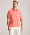 Model is wearing UNTUCKit Wrinkle-Free Damaschino Polo in Heather Coral.