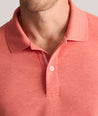 Model is wearing UNTUCKit Wrinkle-Free Damaschino Polo in Heather Coral.