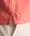 Model is wearing UNTUCKit Wrinkle-Free Damaschino Polo in Heather Coral.
