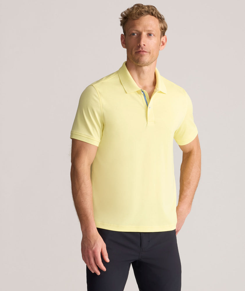 Model is wearing UNTUCKit Wrinkle-Free Damaschino Polo in yellow.