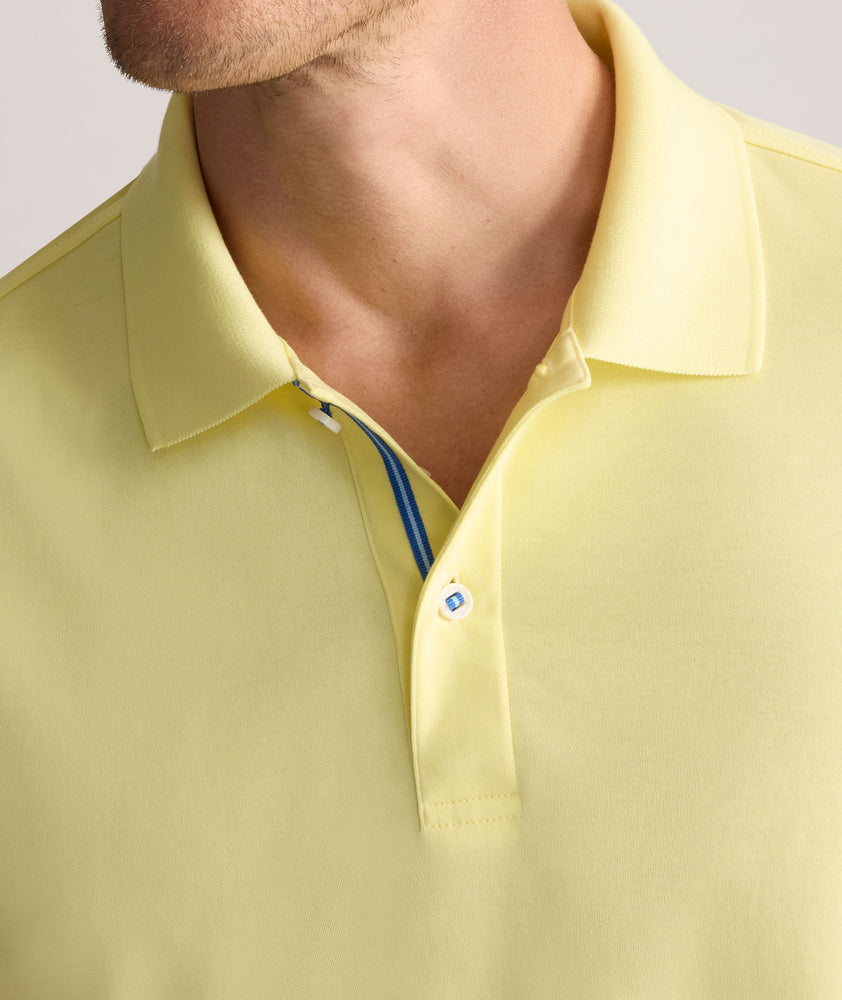 Model is wearing UNTUCKit Wrinkle-Free Damaschino Polo in yellow.