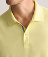 Model is wearing UNTUCKit Wrinkle-Free Damaschino Polo in yellow.