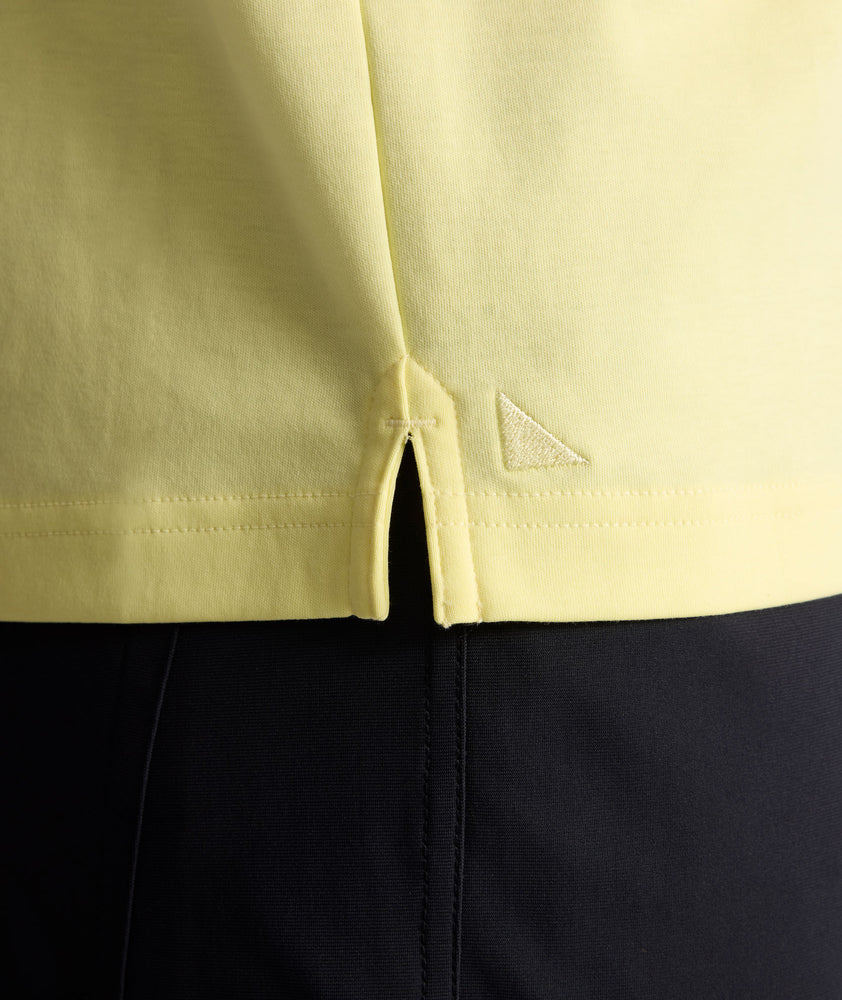 Model is wearing UNTUCKit Wrinkle-Free Damaschino Polo in yellow.