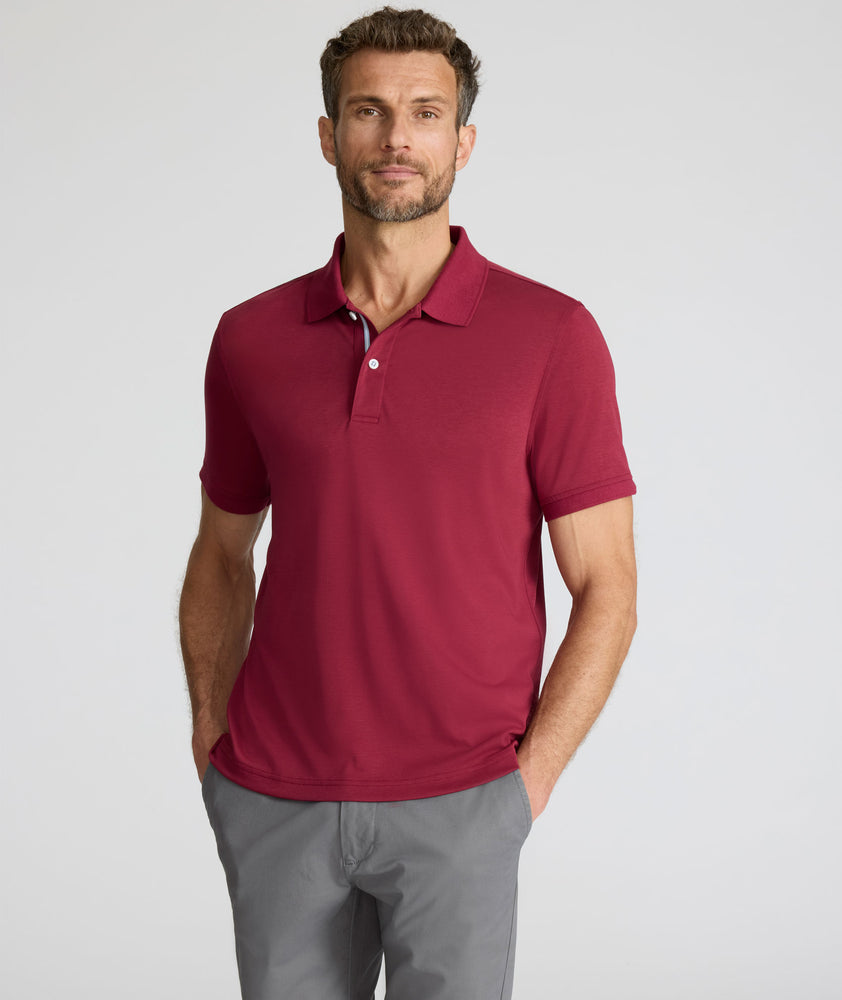 Model is wearing UNTUCKit Wrinkle-Free Damaschino Polo in Burgundy.