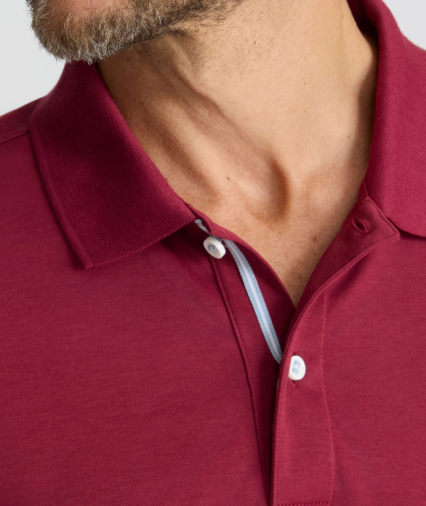 Model is wearing UNTUCKit Wrinkle-Free Damaschino Polo in Burgundy.