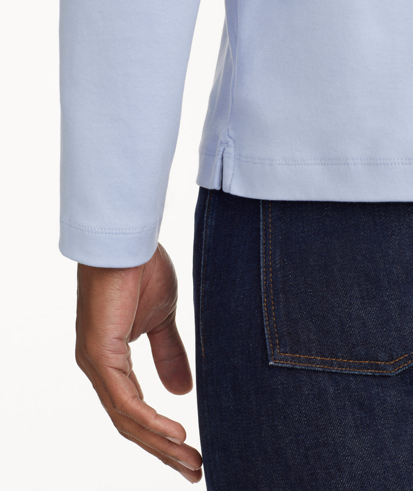 Model is wearing UNTUCKit Wrinkle-Free Long-Sleeve Damaschino Polo in Flower blue.