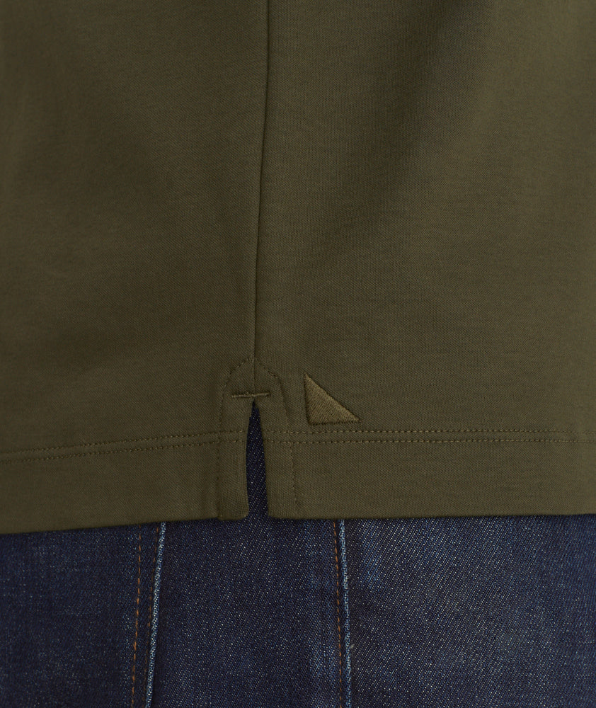 Model is wearing UNTUCKit damaschino long sleeve polo in Forest Night.