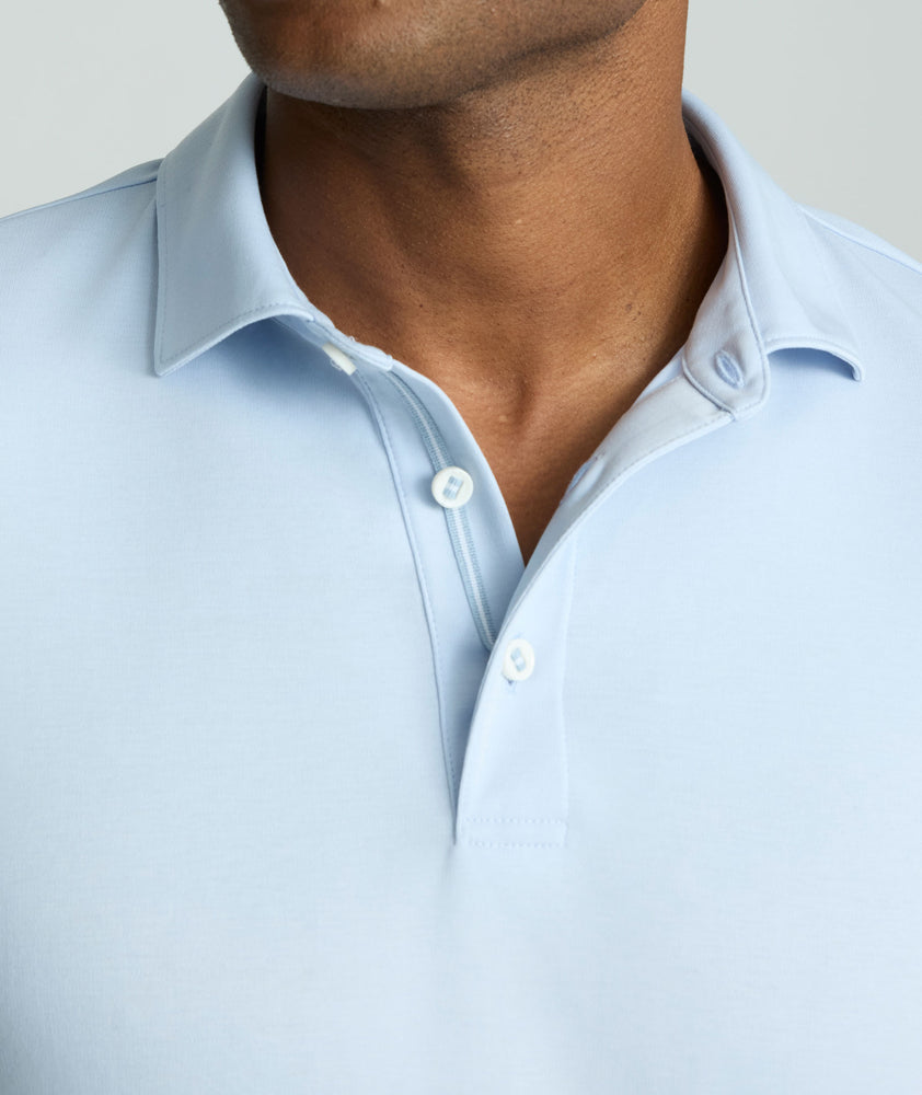 Model is wearing UNTUCKit Wrinkle-Free Damaschino Long-Sleeve Polo in Heather.