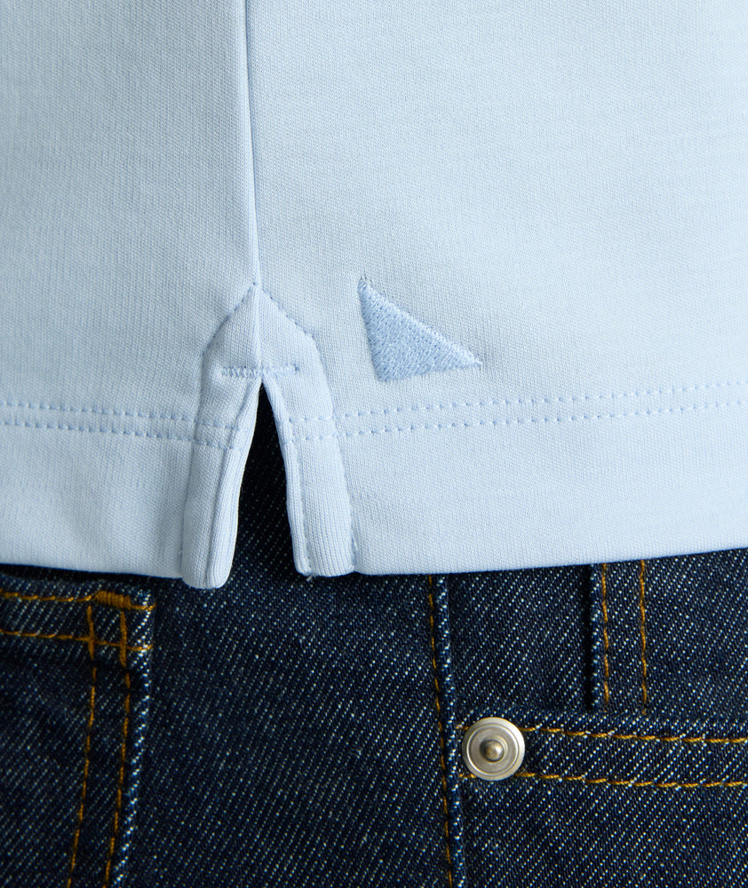 Model is wearing UNTUCKit Wrinkle-Free Damaschino Long-Sleeve Polo in Heather.