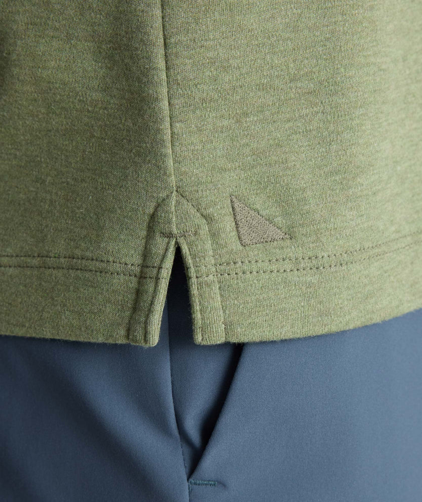 Model is wearing UNTUCKit Wrinkle-Free Damaschino Long-Sleeve Polo in Heather Sage. 