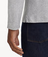 Model is wearing UNTUCKit Wrinkle-Free Long-Sleeve Damaschino Polo in Heather Gray