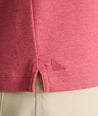 Model is wearing UNTUCKit Wrinkle-Free Damaschino Long-Sleeve Polo in Heather Pink. 