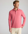 Model is wearing UNTUCKit Wrinkle-Free Damaschino Long-Sleeve Polo in Heather Pink. 