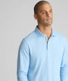Model is wearing UNTUCKit Wrinkle-Free Damaschino Long-Sleeve Polo in Heather Light Blue. 