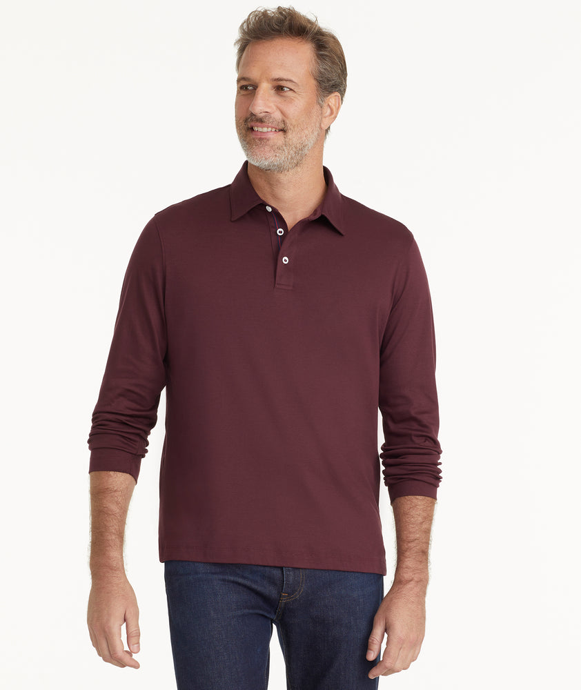 Model is wearing UNTUCKit Wrinkle-Free Long-Sleeve Damaschino Polo in Deep Purple.