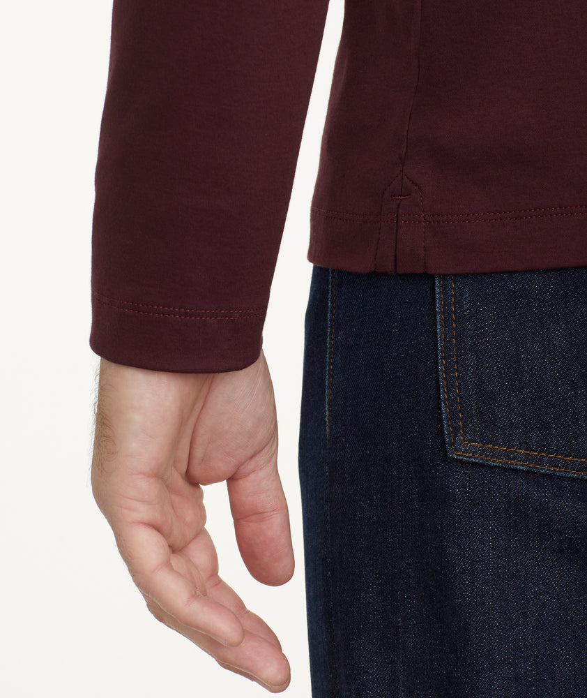 Model is wearing UNTUCKit Wrinkle-Free Long-Sleeve Damaschino Polo in Deep Purple.