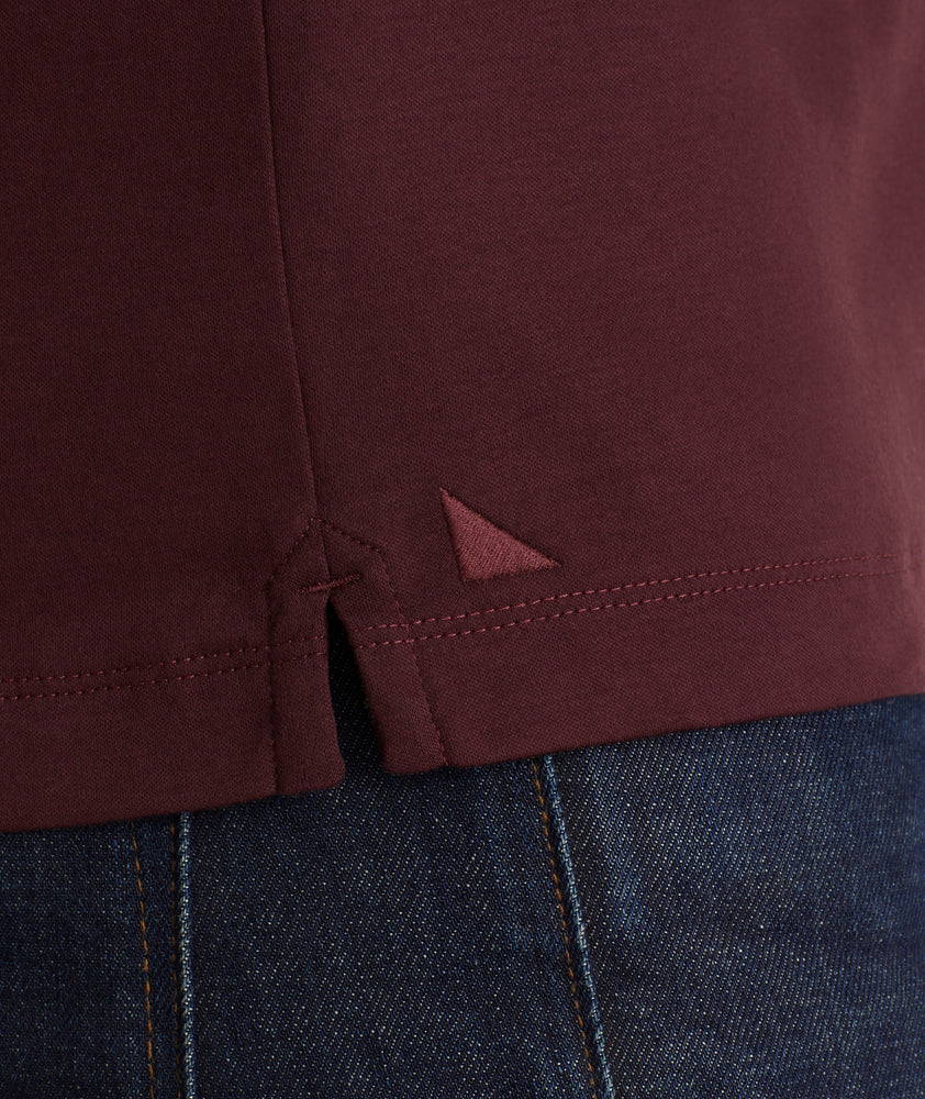 Model is wearing UNTUCKit Wrinkle-Free Long-Sleeve Damaschino Polo in Deep Purple.